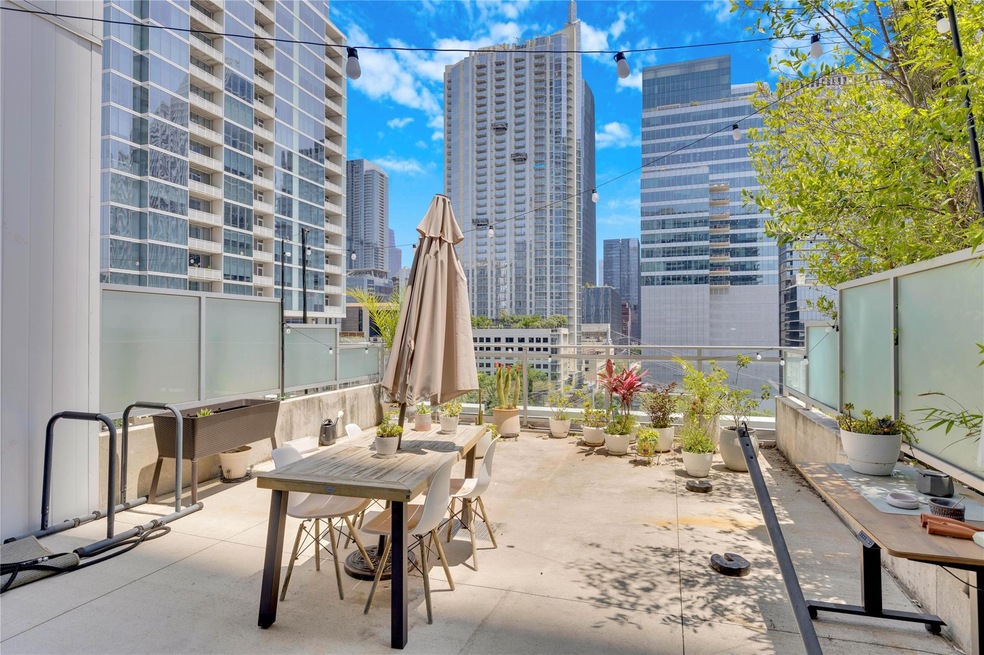 View of patio with a view of skyline and outdoor 
