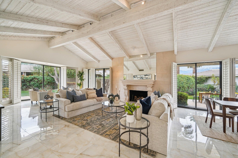 Living area with vaulted beamed ceiling