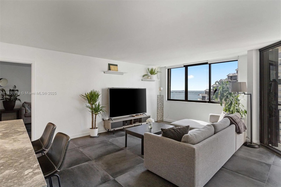 Step into this bright and open living space, where large windows offer stunning views of Biscayne Bay. Desirable split floor plan, ensuring privacy and functionality