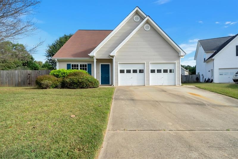 Two car garage and room to park in the driveway, o
