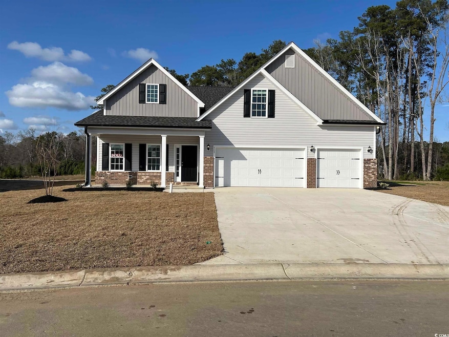 View of front of home with covered porch, board an