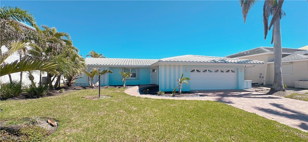 Ranch-style home with stucco siding, driveway, a f