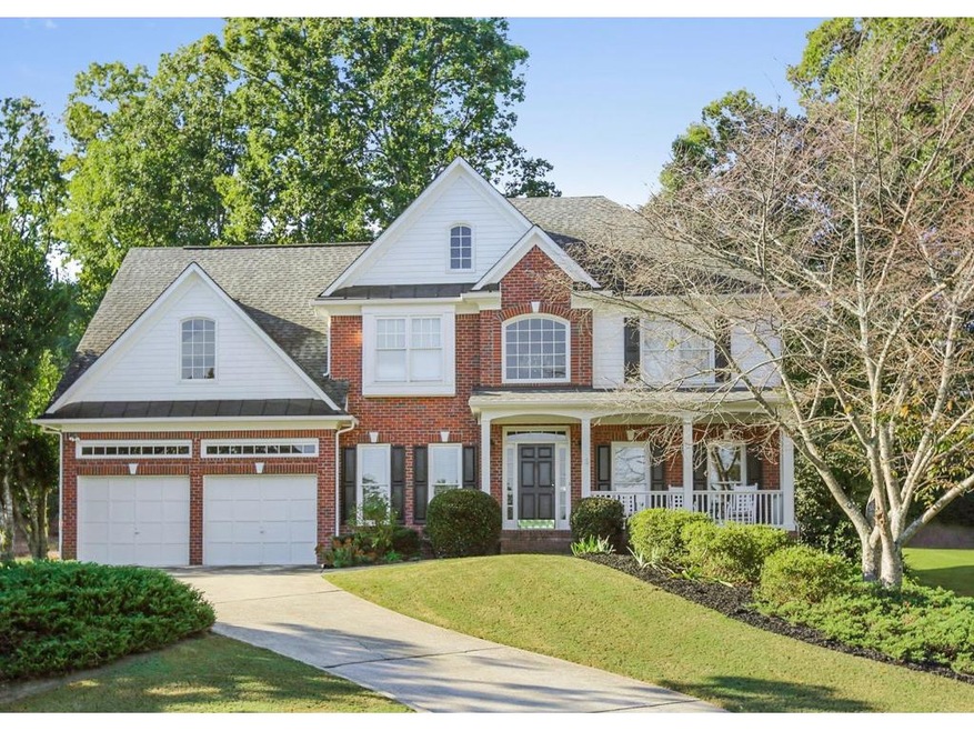 Beautiful brick home with rocking chair front porc