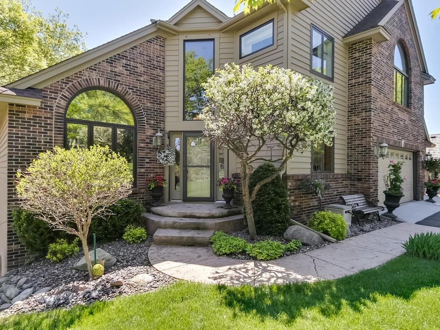 Welcome Home to 6376 Ithaca Lane N nestled on a qu