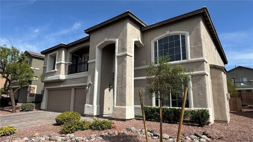 View of front of home featuring stucco siding, a g