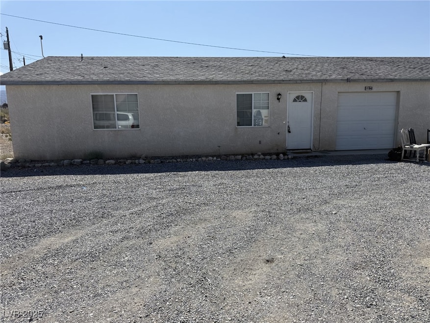View of front facade featuring stucco siding and a