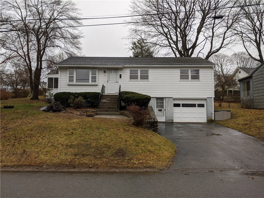 Walk to all the events in downtown Westerly from a convenient rental Ranch at 32 Spring Street just off of Cross Street. The living room opens up to the kitchen and dining room while down the hall are the three bedrooms with nice hardwood floors and a bathroom.  Next to the kitchen is a three season porch with both windows and screens.  The attached garage is part of the unfinished basement. The backyard is perfect for grilling and badminton!  Check it out!