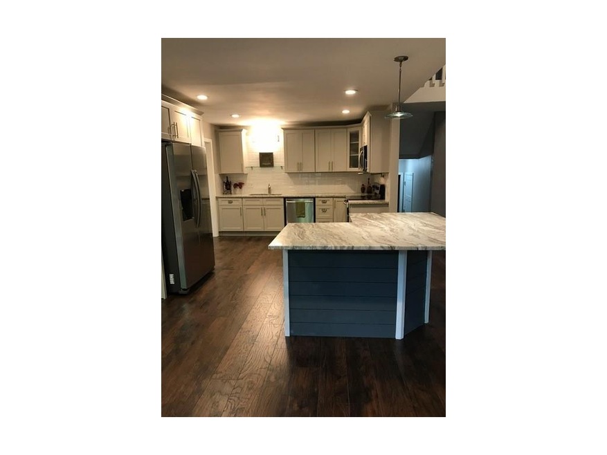 New kitchen with pot filler over stove, ship lap o