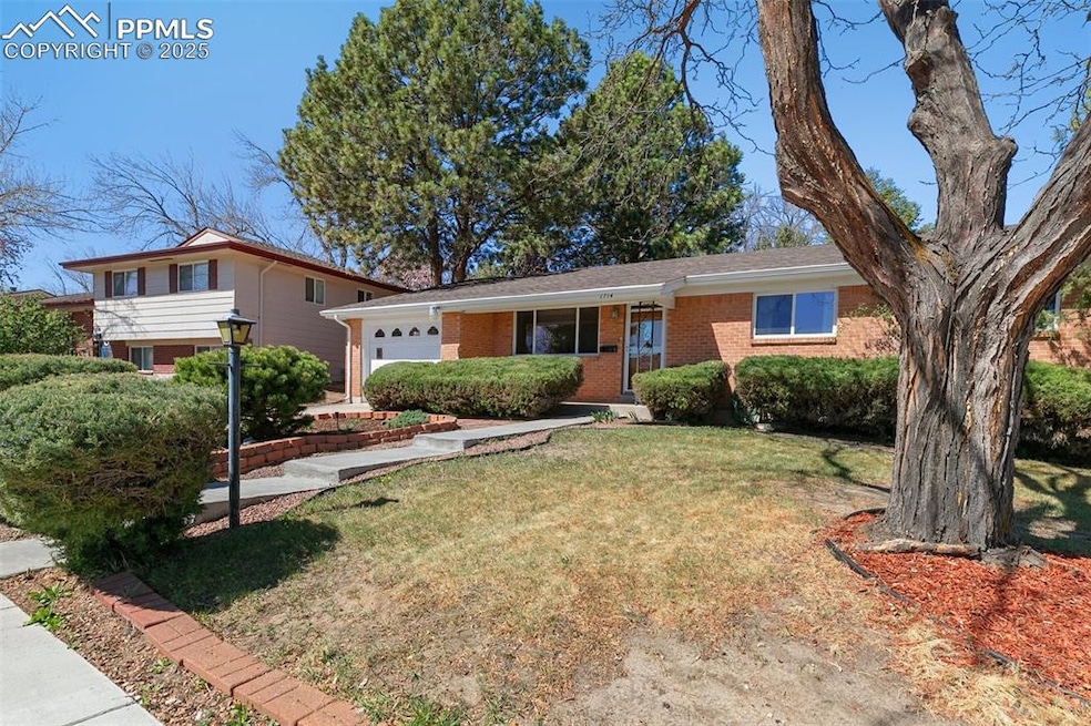 Mid century home with a low maintenance, brick exterior