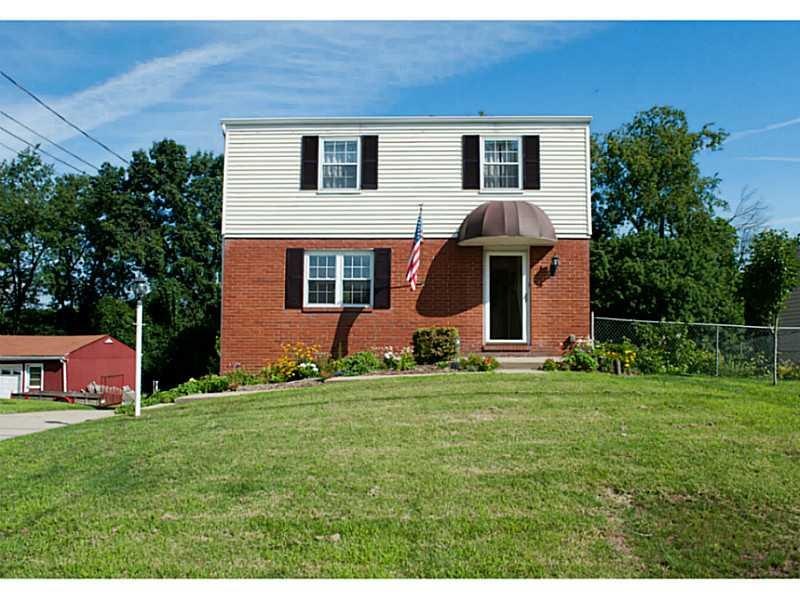 Exterior Front. Solid brick home on a nice lot wit