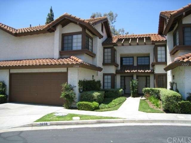Stylish Exterior With Nicely Landscaped Planters a