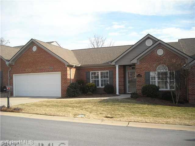 Exterior Front. Low maintenance brick and vinyl, architectural shingled roof. Two-car garage that is actually large enough for two full-sized cars.