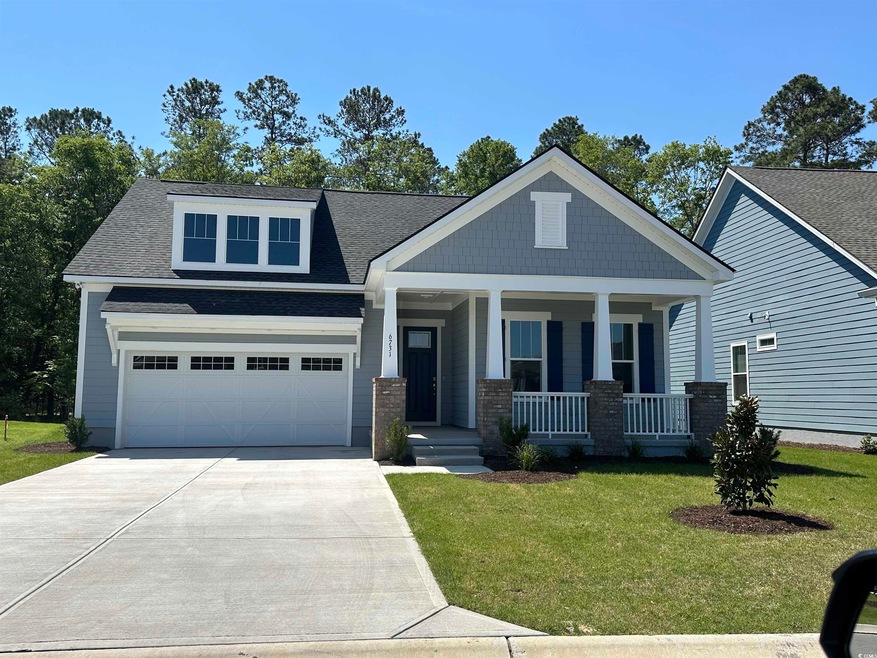 Craftsman-style house featuring a porch, a shingle