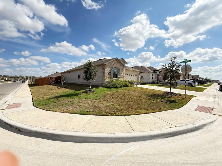 Ranch-style house with concrete driveway, a residential view, and a garage