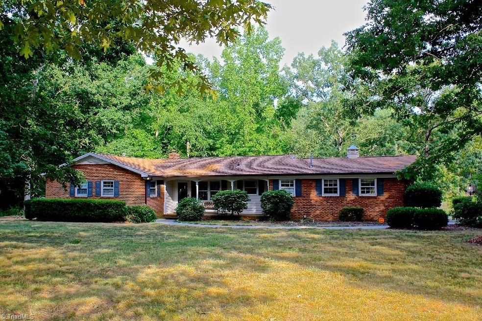 Sprawling ranch home on with almost 3 acres , a small lake , fruit trees and more!