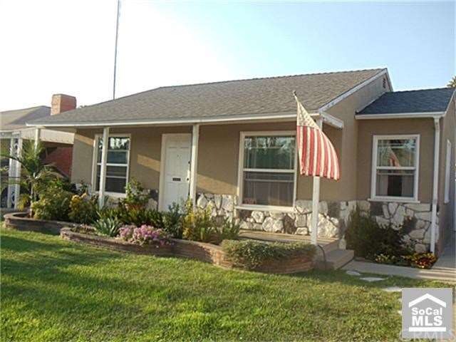 Close up of front yard with porch.