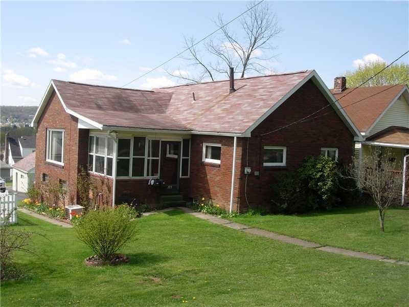 Exterior Front. PEACEFUL SETTING  FOR THIS BRICK R