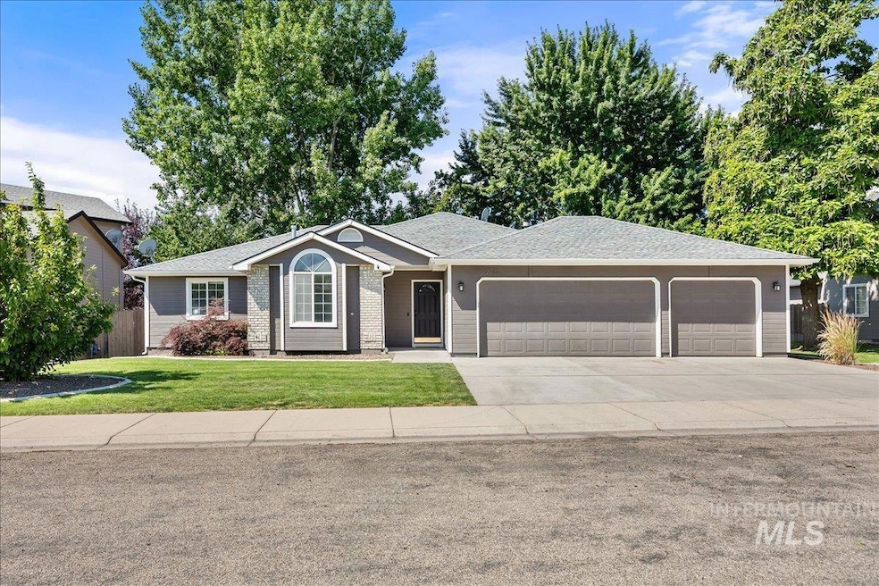 Ranch-style house featuring an attached garage, concrete driveway, and a shingled roof