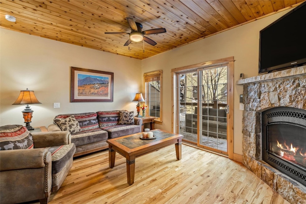 Living room with cozy gas fireplace and access to
