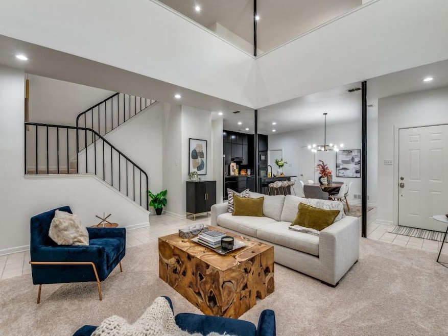 Carpeted Living room open to Dining Rm. & Kitchen