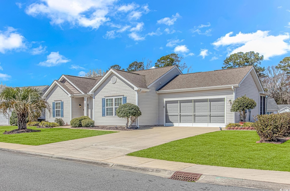 Single story home with an attached garage, drivewa