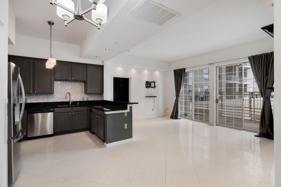 Open concept kitchen, living and dining area.