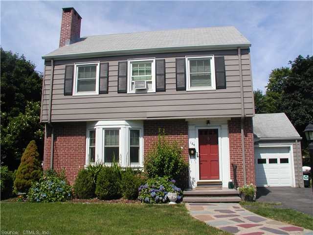 Exterior Front. Brick/Aluminum siding on this clas