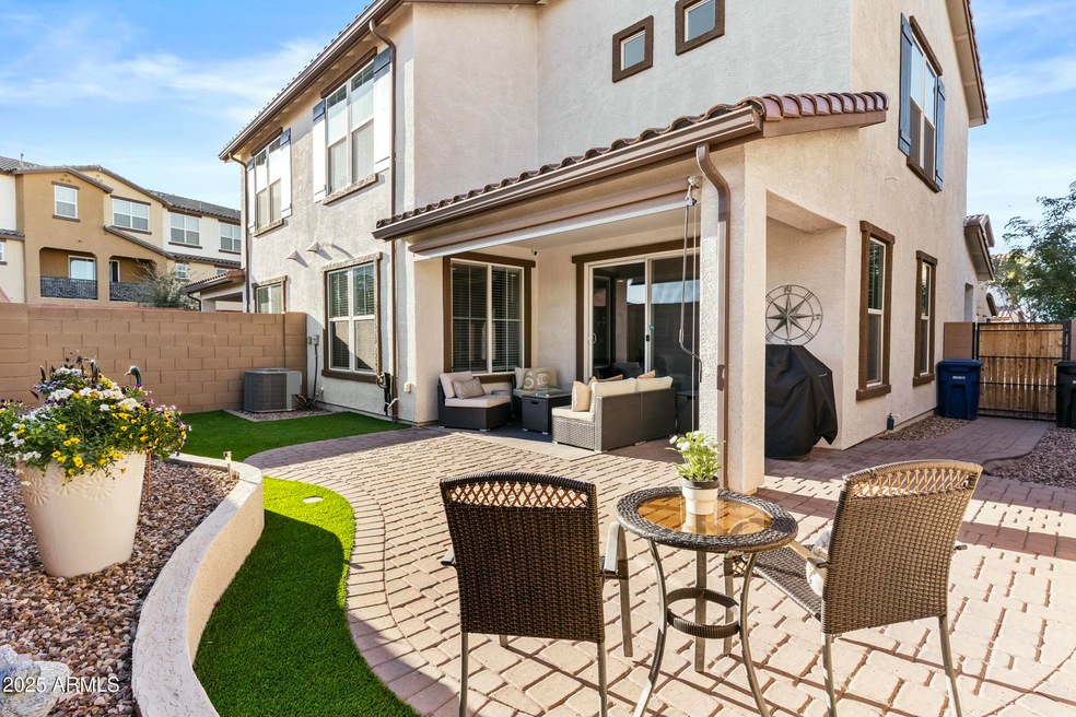 Pavers, faux grass, raised bed