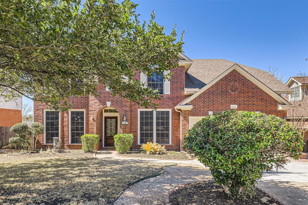 View of front of property with a garage, a shingl