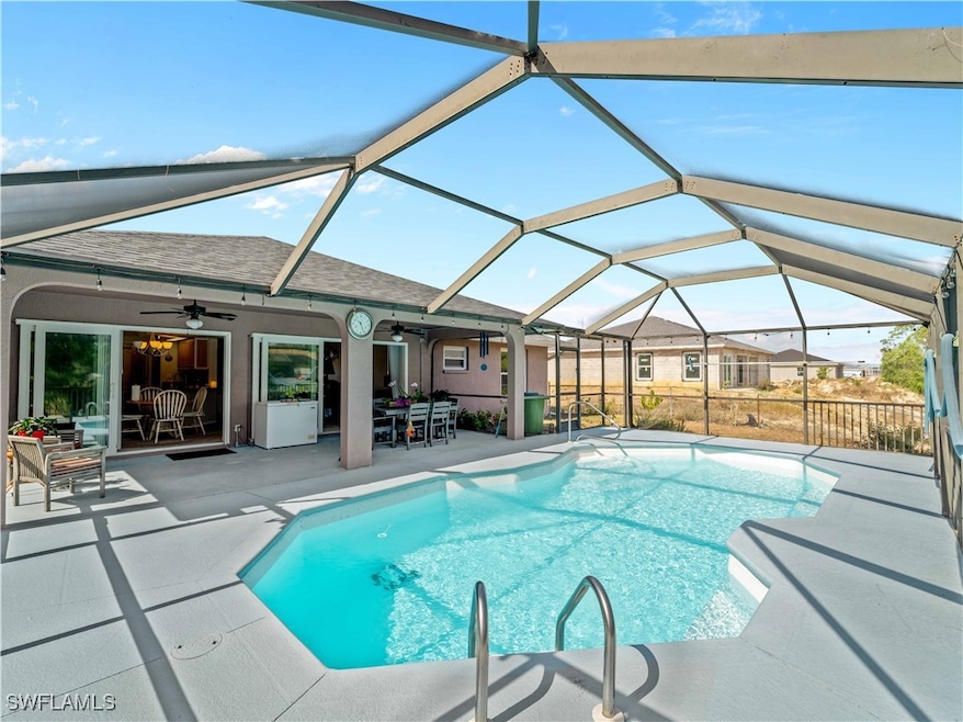 Pool with a patio area, outdoor dining space, ceil