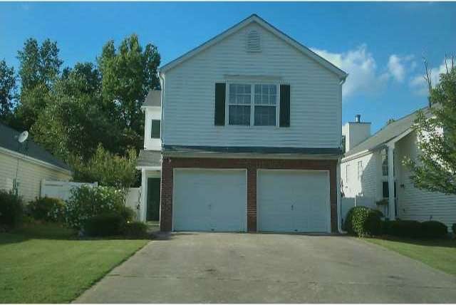 Exterior Front. Front of home, with side entrance