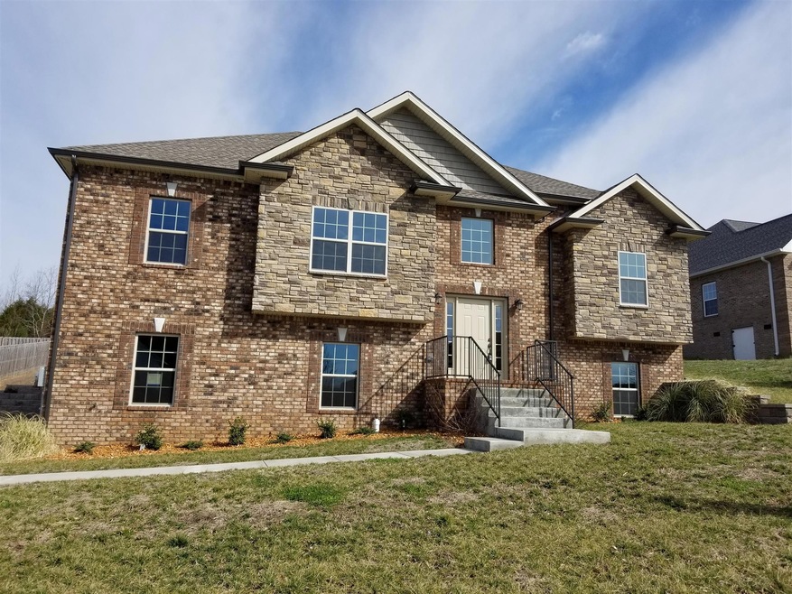 Stylish craftsman features on the front of this color coordinated home!