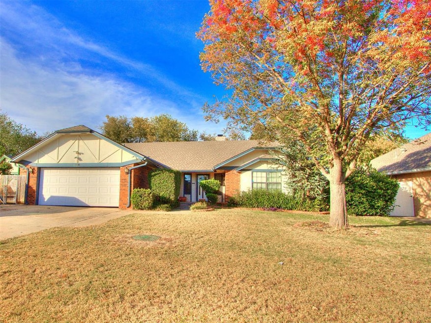 Ranch-style house featuring brick siding, a front yard, driveway, an attached garage, and a shingled roof