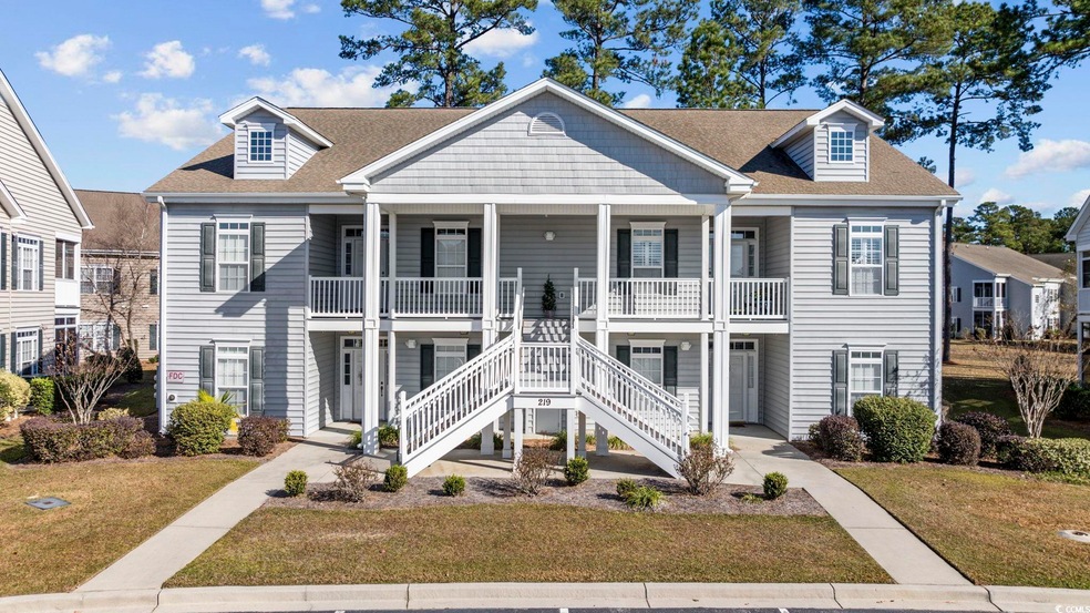 View of front of home with covered porch and a fro