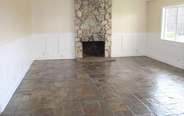 Living room features an attractive white wainscoti