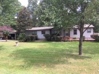 Beautiful 1/2 ac wooded lot.  3 bedroom + office.  2 car detached garage with attached 24x20 carport. Quiet neighborhood with community pool.  New roof 7/2020.