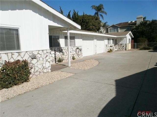 Front view of duplex.  Both units have a single ca