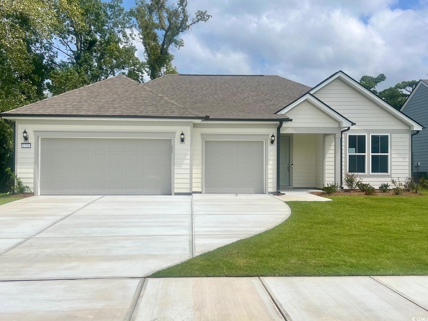 Ranch-style home with a garage and a front yard