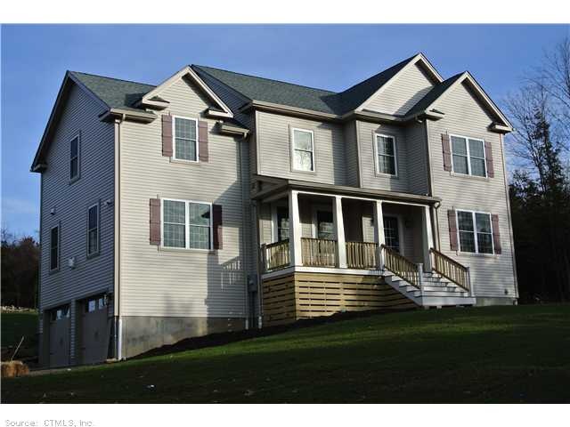 Exterior Front. Tappered front columns, board and 