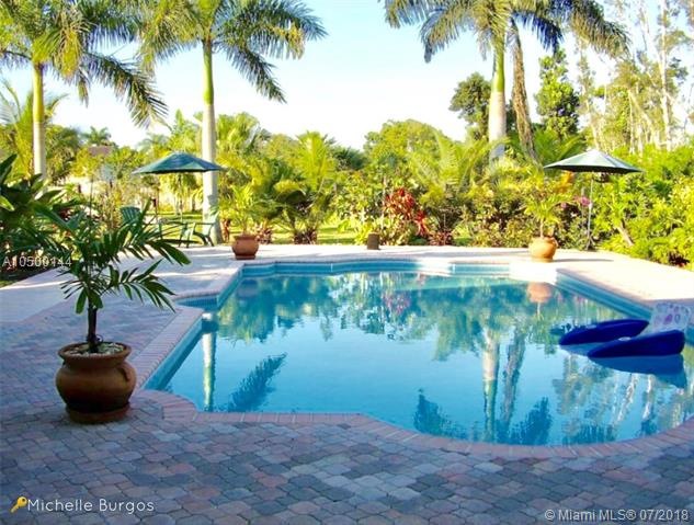Fully fenced back yard with 18x36 Sports Pool with