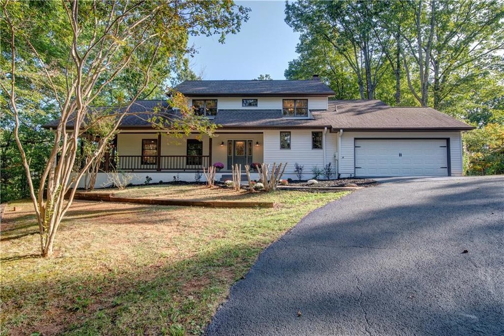 Privacy as you enter this farm style home. Plenty 