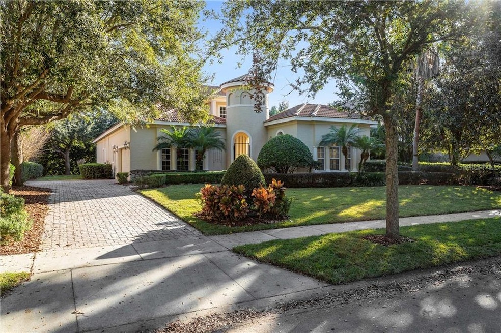 Mature Trees line the street.   Paver Driveway wel