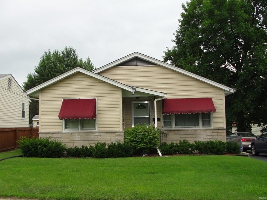 Beautifully maintained with stone and vinyl siding