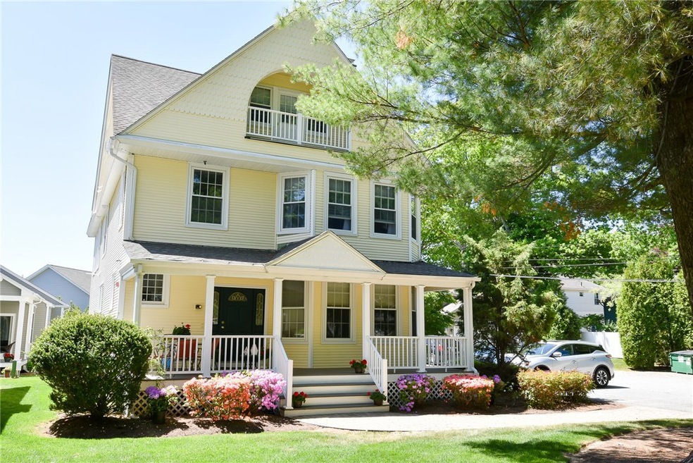 Front of building with view of the bedroom balcony