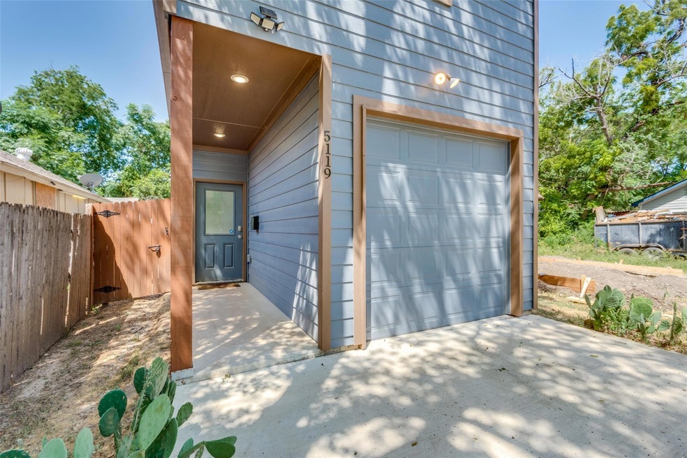 Garage featuring wooden walls
