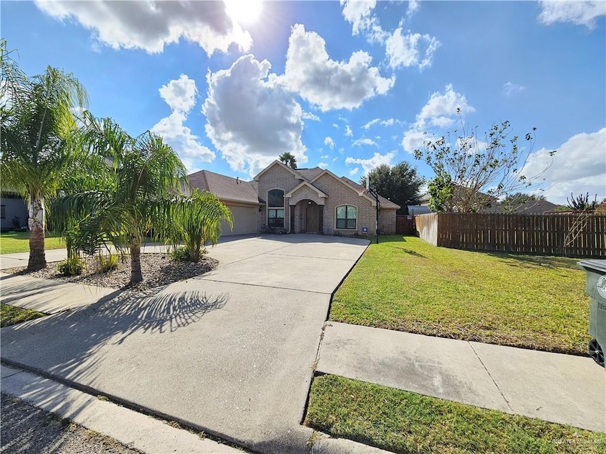 View of front of property featuring driveway and a garage