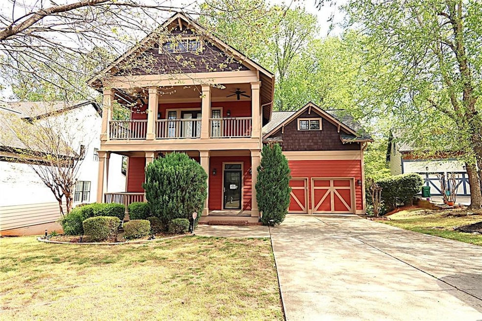 Front view of home featuring concrete driveway, a 