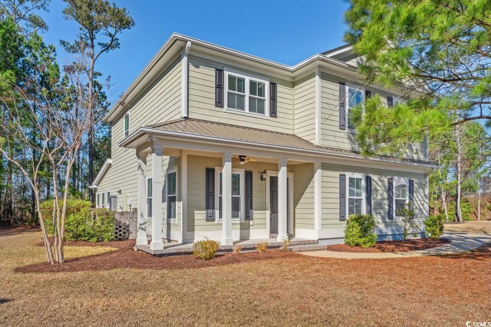 View of front facade with a front yard and a porch