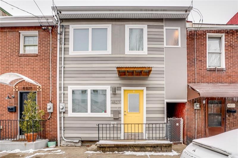 This renovated home features a large back deck for