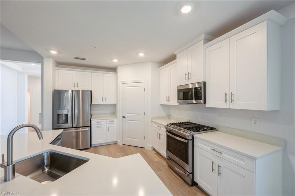 Kitchen featuring light wood-style floors, visible
